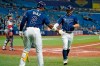 Tampa Bay Rays' Brandon Lowe celebrates with Yandy Diaz (2) after scoring on an RBI single by Austin Meadows off Boston Red Sox starting pitcher Nick Pivetta during the third inning of a baseball game Monday, Aug. 30, 2021, in St. Petersburg, Fla. (AP Photo/Chris O'Meara)