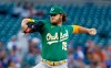 Oakland Athletics starting pitcher Cole Irvin (19) delivers against the Detroit Tigers during the first inning of a baseball game Tuesday, Aug. 31, 2021, in Detroit. (AP Photo/Duane Burleson)
