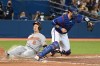 Baltimore Orioles' Ryan Mountcastle (6) slides safely into home ahead of a tag by Toronto Blue Jays' catcher Danny Jansen in the sixth inning of an American League baseball game in Toronto on Tuesday, Aug. 31, 2021. THE CANADIAN PRESS/Jon Blacker