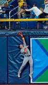 Boston Red Sox right fielder Hunter Renfroe leaps but can't make the catch on a two-run home run by Tampa Bay Rays' Wander Franco during the third inning of a baseball game Wednesday, Sept. 1, 2021, in St. Petersburg, Fla. (AP Photo/Chris O'Meara)