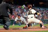 San Francisco Giants catcher Buster Posey, right, prepares to tag out Milwaukee Brewers' Luis Urias at home during the second inning of a baseball game in San Francisco, Wednesday, Sept. 1, 2021. (AP Photo/Jeff Chiu)