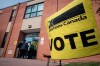 Voters enter the polling station at St. Luigi Catholic School during election day in Toronto on Monday, October 21, 2019. Elections Canada says it still has 
