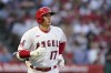 Los Angeles Angels designated hitter Shohei Ohtani (17) runs to first base as he flies out to second during the ninth inning of a baseball game against the New York Yankees Wednesday, Sep. 1, 2021, in Anaheim, Calif. (AP Photo/Ashley Landis)