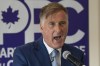 People's Party of Canada Leader Maxime Bernier responds to reporters' questions after launching his campaign during a press conference at a hotel in Saint-Georges, Que., Friday, Aug. 20, 2021. After the deficit is eliminated the PPC say they would cut personal income taxes, corporate taxes and the personal capital gains tax. THE CANADIAN PRESS/Jacques Boissinot