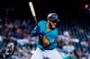 Seattle Mariners' Abraham Toro is hit by a pitch from Arizona Diamondbacks starter Madison Bumgarner during the first inning of a baseball game Friday, Sept. 3, 2021, in Phoenix. (AP Photo/Ross D. Franklin)