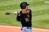 Pittsburgh Pirates' Yoshi Tsutsugo singles off Detroit Tigers relief pitcher Kyle Funkhouser, driving in two runs, during the seventh inning of a baseball game in Pittsburgh, Monday, Sept. 6, 2021. (AP Photo/Gene J. Puskar)
