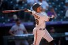 San Francisco Giants' Thairo Estrada follows the flight of his two-run home run off Colorado Rockies starting pitcher Kyle Freeland in the fifth inning of a baseball game Monday, Sept. 6, 2021, in Denver. (AP Photo/David Zalubowski)