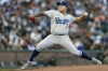 Los Angeles Dodgers starting pitcher Julio Urias works against the San Francisco Giants in the first inning of a baseball game in San Francisco, Saturday, Sept. 4, 2021. (AP Photo/John Hefti)
