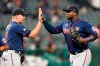 Minnesota Twins' Miguel Sano, right, celebrates with relief pitcher Tyler Duffey after the Twins defeated the Cleveland Indians 3-0 in a baseball game Wednesday, Sept. 8, 2021, in Cleveland. (AP Photo/Tony Dejak)