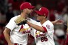 St. Louis Cardinals' Giovanny Gallegos (65) and teammate Adam Wainwright celebrate a 5-4 victory over the Los Angeles Dodgers in a baseball game Wednesday, Sept. 8, 2021, in St. Louis. (AP Photo/Jeff Roberson)