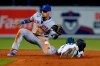 New York Mets second baseman Javier Baez (23) is unable to catch the throw as Miami Marlins' Jazz Chisholm Jr. steals second base during the sixth inning of a baseball game Thursday, Sept. 9, 2021, in Miami. (AP Photo/Wilfredo Lee)