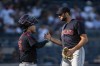 Cleveland Indians relief pitcher Sam Hentges, left, celebrates with catcher Roberto Perez after defeating the New York Yankees in a baseball game Sunday, Sept. 19, 2021, in New York. (AP Photo/Eduardo Munoz Alvarez)