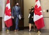 Prime Minister Justin Trudeau, left, arrives with Deputy Prime Minister and Minister of Finance Chrystia Freeland as she prepares to table the federal budget in the House of Commons in Ottawa, on Monday, April 19, 2021. THE CANADIAN PRESS/Justin Tang