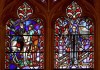 FILE - This Wednesday, Sept. 6, 2017 file photo shows stained glass windows depicting two Confederate generals at the Washington National Cathedral. Washington National Cathedral has chosen contemporary artist Kerry James Marshall, renowned for his wide-ranging works depicting African-American life, to design new stained-glass windows with themes of racial justice to replace windows with Confederate imagery that were removed from the landmark sanctuary in 2017. (AP Photo/Carolyn Kaster)