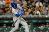 Kansas City Royals' Whit Merrifield hits a sacrifice fly, scoring Kyle Isbel, in the eighth inning of a baseball game against the Detroit Tigers, Friday, Sept. 24, 2021, in Detroit. (AP Photo/Jose Juarez)