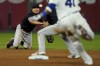 Cleveland Indians shortstop Yu Chang throws to second too late for the out on Kansas City Royals' Carlos Santana (41) as he advanced to second on a single by Hunter Dozier during the sixth inning of a baseball game Thursday, Sept. 30, 2021, in Kansas City, Mo. Kansas City, Mo. (AP Photo/Charlie Riedel)