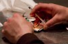 A man prepares heroin to be injected at the Insite safe injection clinic in Vancouver, B.C., Wednesday May 11, 2011. As Toronto continues to see record numbers of drug-related deaths, the city is gearing up to ask Health Canada for an exemption to decriminalize the possession of illicit drugs for personal use. THE CANADIAN PRESS/Darryl Dyck