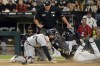 Chicago White Sox's Tim Anderson scores under the tag from Detroit Tigers catcher Eric Haase (13) during the fourth inning of a baseball game, Friday, Oct. 1, 2021, in Chicago. (AP Photo/Matt Marton)