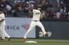 San Francisco Giants' Brandon Crawford throws to first on a ground ball hit by Arizona Diamondbacks' Ketel Marte during the first inning of a baseball game in San Francisco, Thursday, Sept. 30, 2021. (AP Photo/Jed Jacobsohn)