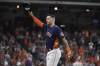 Houston Astros' Carlos Correa acknowledges the crowd after being pulled from baseball game before the ninth inning against the Oakland Athletics, Sunday, Oct. 3, 2021, in Houston. (AP Photo/Eric Christian Smith)