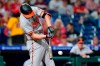Baltimore Orioles' Trey Mancini hits a run-scoring ground out against Philadelphia Phillies pitcher Sam Coonrod during the seventh inning of an interleague baseball game, Wednesday, Sept. 22, 2021, in Philadelphia. (AP Photo/Matt Slocum)
