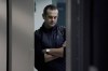 New York Yankees manager Aaron Boone waits in the hallway to attend a news conference at the American League Wild Card Workout Day at Fenway Park, Monday, Oct. 4, 2021, before Tuesday's American League Wild Card game against the Boston Red Sox in Boston. (AP Photo/Mary Schwalm)