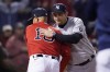 New York Yankees manager Aaron Boone, right, greets Boston Red Sox manager Alex Cora before an American League Wild Card baseball game at Fenway Park, Tuesday, Oct. 5, 2021, in Boston. (AP Photo/Charles Krupa)