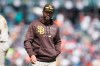 San Diego Padres manager Jayce Tingler walks to the dugout after making a pitching change during the sixth inning of the team's baseball game against the San Francisco Giants in San Francisco, Thursday, Sept. 16, 2021. (AP Photo/Jeff Chiu)
