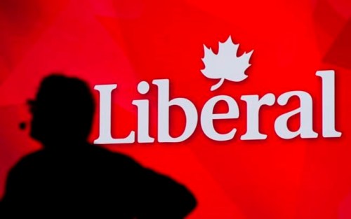 A Liberal Party of Canada logo is shown on a giant screen as a technician looks on during day one of the party's biennial convention in Montreal, Thusday, Feb. 20, 2014. Federal Liberals say they've picked up another seat in Quebec after a judicial recount.They say incumbent Brenda Shanahan will be returning to Parliament after the recount declared her the winner in Chateauguay-Lacolle over her Bloc Quebecois rival by just 12 votes. THE CANADIAN PRESS/Graham Hughes