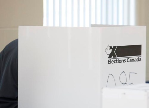 A man casts his ballot at a polling station on federal election day in Shawinigan, Que., Monday, Oct. 21, 2019. THE CANADIAN PRESS/Graham Hughes