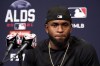 Chicago White Sox's Luis Robert listens to reporters' questions at a news conference during a baseball workout for the American League Divisions Series, Saturday, Oct. 9, 2021, in Chicago. The White Sox host the Houston Astros in Game 3 on Sunday.(AP Photo/Nam Y. Huh)