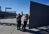 Mexican security officers open the main gate of the international border bridge that connects Del Rio, Texas and Ciudad Acuna, Mexico, after its partial reopening Saturday, Sept. 25, 2021. A new trilateral poll suggests U.S. residents are far more worried about reopening the land border with Mexico than they are about letting Canadians drive into the country.THE CANADIAN PRESS/AP/Fernando Llano