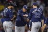 Tampa Bay Rays manager Kevin Cash hands the ball to pitcher Pete Fairbanks (29) during a pitching change in the seventh inning against the Boston Red Sox during Game 4 of a baseball American League Division Series, Monday, Oct. 11, 2021, in Boston. (AP Photo/Charles Krupa)