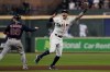 Houston Astros shortstop Carlos Correa celebrates after tagging out Boston Red Sox's Alex Verdugo at second to end the top of the seventh inning in Game 6 of baseball's American League Championship Series Friday, Oct. 22, 2021, in Houston. (AP Photo/Tony Gutierrez)
