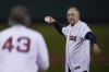 FILE - Former Boston Red Sox player Jerry Remy, wearing an oxygen tube, throws a ceremonial first pitch to former Red Sox pitcher Dennis Eckersley before an American League Wild Card baseball game against the New York Yankees at Fenway Park, Tuesday, Oct. 5, 2021, in Boston. Remy, a Boston Red Sox second baseman who went on to become a local icon as a television broadcaster, died of cancer on Saturday, Oct. 30, 2021. He was 68. (AP Photo/Charles Krupa, File)