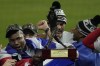 Atlanta Braves designated hitter Jorge Soler holds up the MVP trophy after winning baseball's World Series in Game 6 against the Houston Astros Tuesday, Nov. 2, 2021, in Houston. The Braves won 7-0. (AP Photo/Ashley Landis)