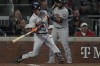 Houston Astros' Alex Bregman hits a RBI-double during the second inning in Game 5 of baseball's World Series between the Houston Astros and the Atlanta Braves Sunday, Oct. 31, 2021, in Atlanta. (AP Photo/Brynn Anderson)