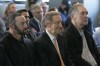 San Francisco Giants manager Gabe Kapler, left, president and CEO Larry Baer, and former manager Bruce Bochy, right, listen to Giants catcher Buster Posey during a news conference announcing his retirement from baseball, Thursday, Nov. 4, 2021, in San Francisco. (AP Photo/Tony Avelar)