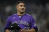 FILE - Colorado Rockies relief pitcher Jhoulys Chacin pauses during the seventh inning of the team's baseball game against the Chicago Cubs on Aug. 4, 2021, in Denver. Chacín is staying with the Rockies, agreeing Saturday, Nov. 13, to a guaranteed $1.25 million, one-year contract that allows him to earn an additional $500,000 in performance bonuses. (AP Photo/David Zalubowski, File)
