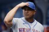 FILE - New York Mets manager Luis Rojas looks over before a baseball game against the Los Angeles Dodgers in Los Angeles, Sunday, Aug. 22, 2021. On Monday, Nov. 15, 2021, the New York Yankees hired former Mets manager Rojas as their third base coach, a month after he lost his job with the crosstown rivals. (AP Photo/Alex Gallardo, File)