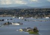 Properties inundated by flood waters are seen in Abbotsford, B.C., Tuesday, Nov. 16, 2021. Farmers in B.C. are coming together to save livestock as parts of the Fraser Valley are under water due to devastating flooding says an association that represents the province's dairy farmers. THE CANADIAN PRESS/Jonathan Hayward