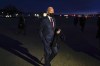 President Joe Biden walks over to speak to reporters as he prepares to depart Manchester-Boston Regional Airport, Tuesday, Nov. 16, 2021, in Manchester, N.H. (AP Photo/Evan Vucci)