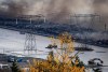 Burnt truck and recreational vehicles are seen during a fire at a business surrounded by floodwaters in Abbotsford, B.C., on Wednesday, November 17, 2021. THE CANADIAN PRESS/Darryl Dyck