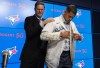 Ross Atkins, executive vice president of baseball operations and general Manager of The Toronto Blue Jays, places a jersey on starter Jose Berrros during a press conference announcing his seven-year extension with the team at the Rogers Centre in Toronto on Thursday, November 18, 2021. THE CANADIAN PRESS/Tijana Martin