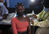 FILE - A young woman reacts as she receives a Pfizer jab against COVID-19, in Diepsloot Township near Johannesburg Thursday, Oct. 21, 2021. A new COVID-19 variant has been detected in South Africa that scientists say is a concern because of its high number of mutations and rapid spread among young people in Gauteng, the country's most populous province, Minister of Health Joe Phaahla announced Thursday, Nov. 25, 2021. (AP Photo/Denis Farrell, File)