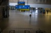 A man walks through a deserted part of Johannesburg's OR Tambo's airport, South Africa, Monday Nov. 29, 2021. The World Health Organisation urged countries around the world not to impose flight bans on southern African nations due to concern over the new omicron variant. THE CANADIAN PRESS/AP, Jerome Delay