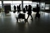 Passengers make their way through Montreal-Trudeau airport in Montreal, on Wednesday, December 1, 2021. THE CANADIAN PRESS/Paul Chiasson