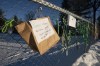 Signs and ribbons are seen on a fence outside an elementary school protesting Quebec Bill 21 and the absence of a teacher, Thursday, Dec. 9, 2021 in Chelsea, Quebec. A western Quebec elementary school teacher has been reassigned from her classroom because her hijab contravenes the province's law forbidding teachers from wearing religious symbols. THE CANADIAN PRESS/Adrian Wyld