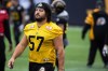 Hamilton Tiger-Cats offensive lineman Brandon Revenberg (57) takes part in a practice at Tim Hortons Field during the CFL's Grey Cup week in Hamilton, Ontario on Friday, December 10, 2021. The Hamilton Tiger-Cats will play the Winnipeg Blue Bombers in the 108th Grey Cup on Sunday. THE CANADIAN PRESS/Nick Iwanyshyn