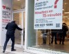 People enter a COVID-19 rapid testing business in Montreal, Saturday, Dec. 4, 2021. THE CANADIAN PRESS/Graham Hughes